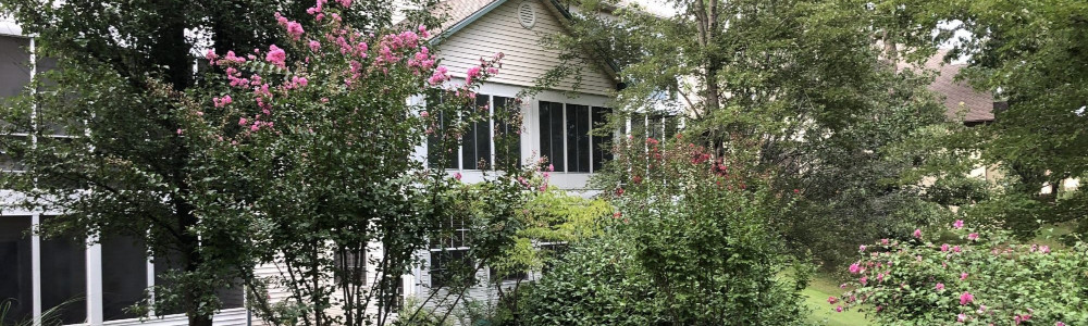 From the backyard you can see the sunroom to this Branson condo at Pointe Royale