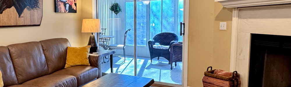 The Living Room leads to the sunroom of this Pointe Royale Branson condo