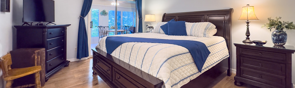 Master Bedoom of this Pointe Royale Branson condo leads to the sunroom