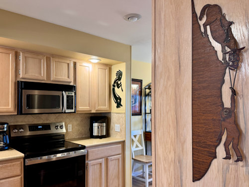Even the kitchen at this Pointe Royale Branson condo has unique art